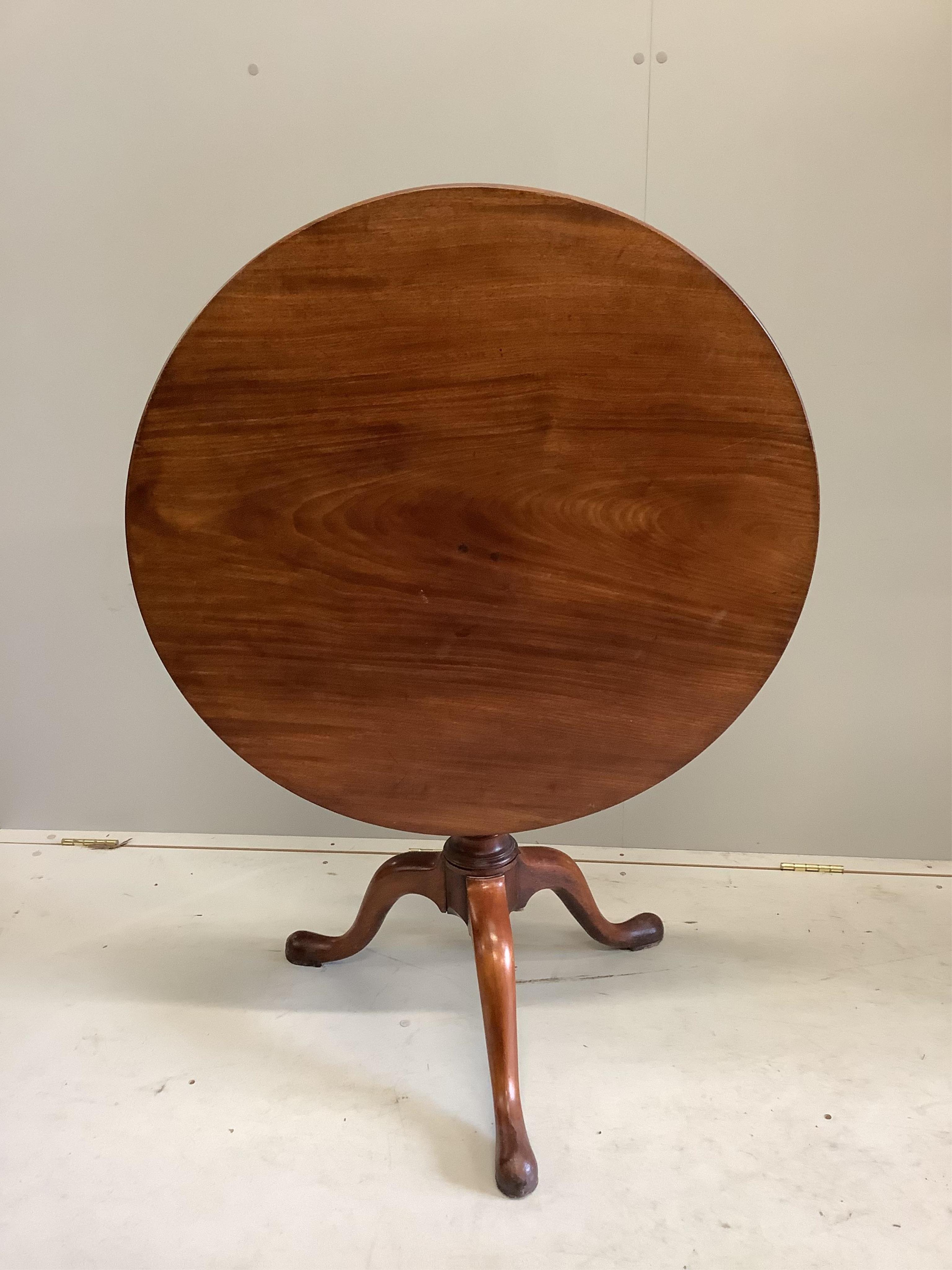 A George III circular mahogany tilt top bird cage tripod tea table, diameter 82cm, height 71cm. Condition - fair